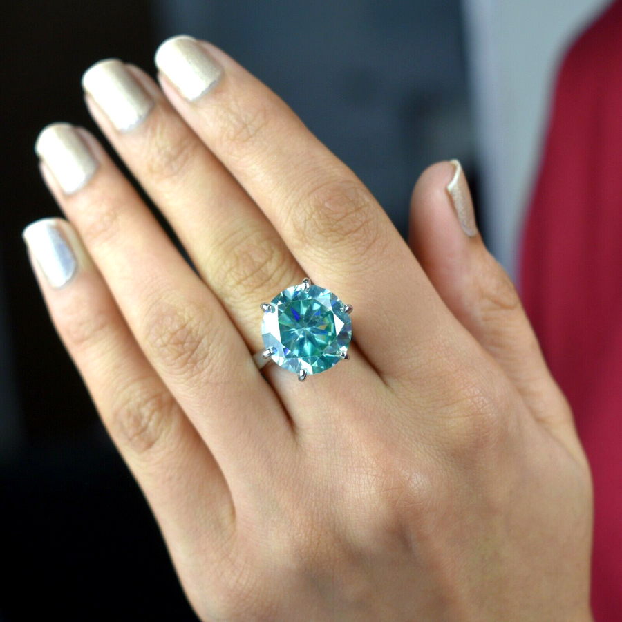 Beautiful Golden Ring with Blue Big Stone and Diamonds Around in Hand Near  Present Box Stock Photo - Image of proposal, crystal: 264835314